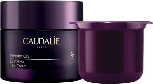 En mörklila burk och en lila behållare med öppet lock, troligen hud- eller kosmetikaprodukter.