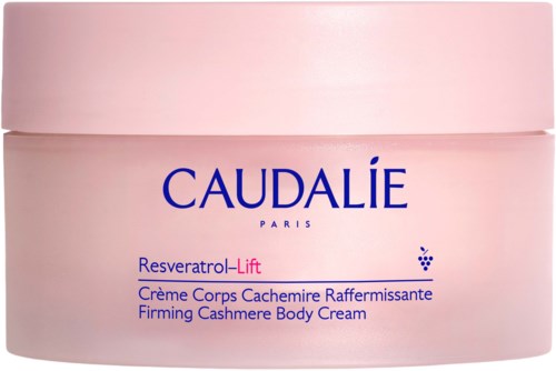 Caudalie vartalovoide purkki vaaleanpunaisessa värissä, tekstit ja logo sinisiä ja violetteja.