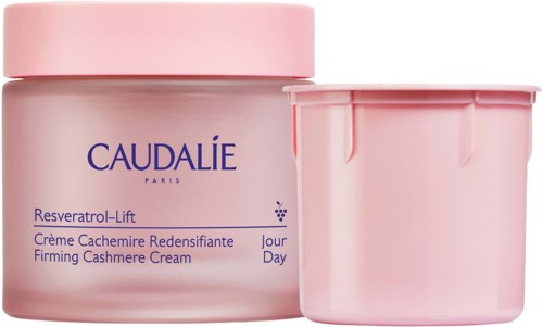 En rosa burk och en matchande behållare för Caudalie hudvårdsprodukt med blå text på framsidan.