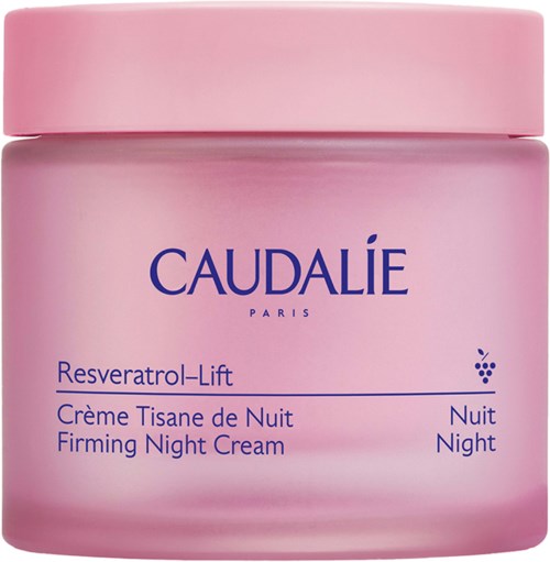Lyserød glas med Caudalie natcreme, mærket Resveratrol-Lift, på en overflade.