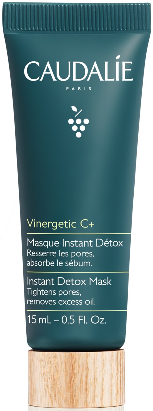 Grön tub med Caudalie Vinergetic C+ Instant Detox Mask med trälock, beskriven som en hudvårdsprodukt som minskar porer och tar bort överflödig olja.