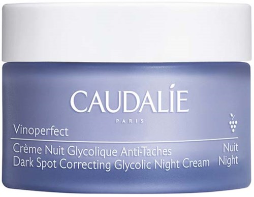 En blå beholder med hvid låg, mærket Caudalie Vinoperfect mørke plet korrigerende natcreme.