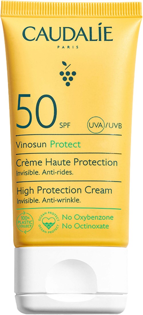 Gul solskyddscreme med blå och gröna texter, SPF 50, nämner UVA och UVB skydd, inget oxybenzone eller octinoxate.