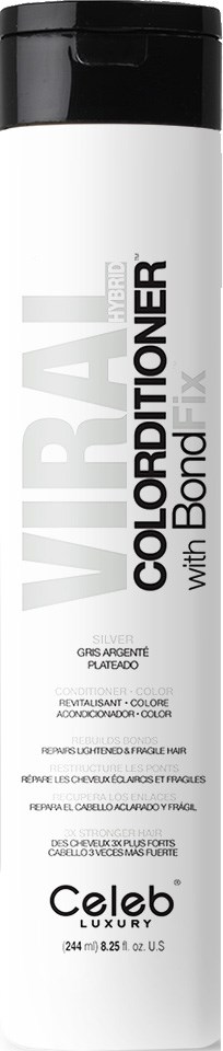 En lång, vit flaska med svart lock, etiketten säger 'COLORBAL with Bond Fix'. Troligtvis för hårfärgning eller behandling.