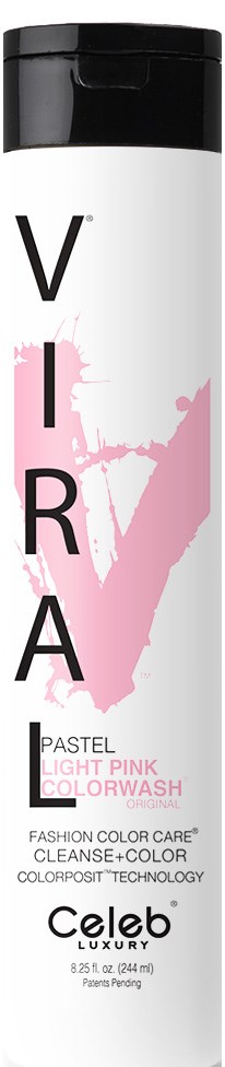 En lång flaska märkt 'VIRA' med rosa färgspill, för färgning av pastellrosa hår.