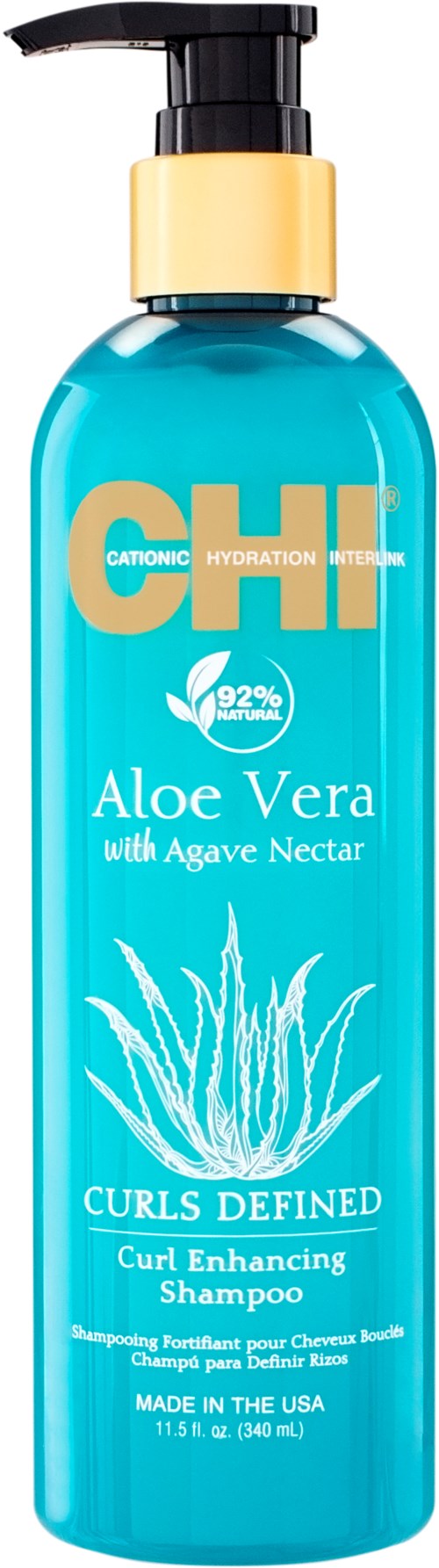 En blå schampoflaska med pump, märkt 'Aloe Vera with Agave Nectar' och 'Curls Defined'.