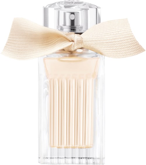 En parfyth bottle med ett stort beige band, klart glas och en krämfärgad parfym inuti.