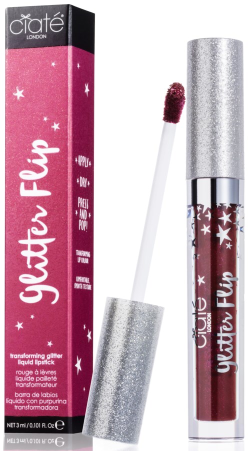 Ett rosa och silverglittrigt flytande läppstift med en matchande förpackning och en borste applicator.