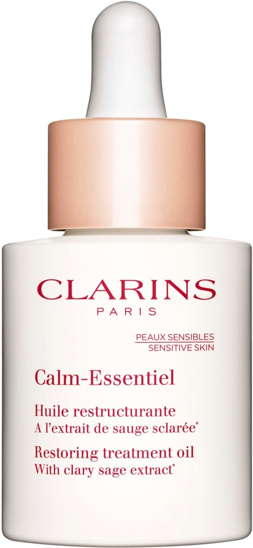 A white bottle with a dropper cap, labeled Clarins Calm-Essentiel, for sensitive skin care, with therapist text.