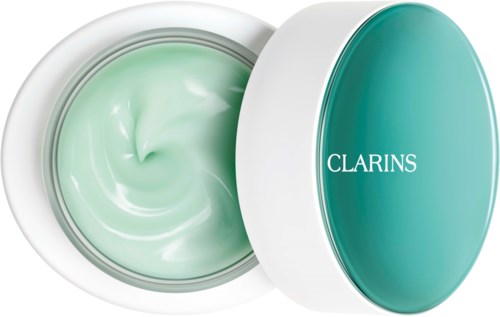 En rund behållare med lock i tealfärg och vit kropp, fylld med ljusgrön salva, märkt 'Clarins'.