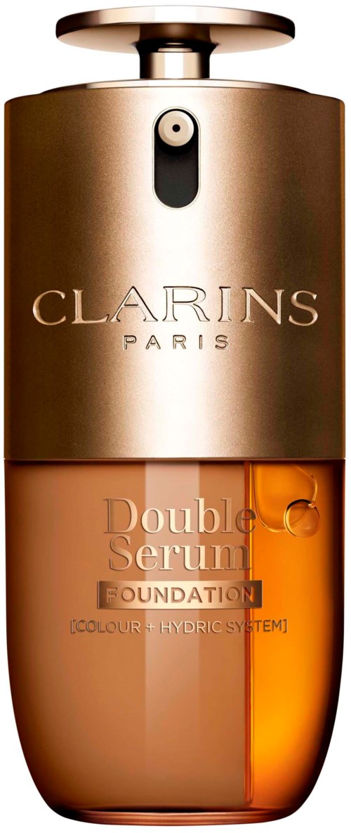 En serumflaska med guld- och bärfärg, märkt 'Clarins Paris' och 'Double Serum Foundation.'