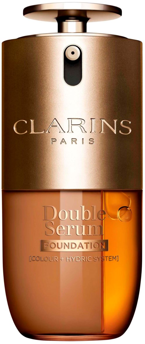 En liten flaska med guldkork, orange botten och texten 'Clarins Paris' och 'Double serum' på.