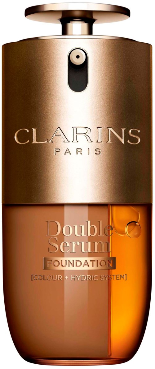 Guldfärgad och orange foundationflaska med Clarins Paris och Double Serum skrivet på den.