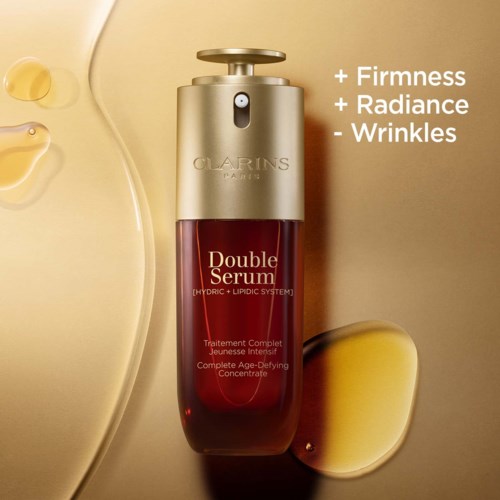 Clarins Double Serum bottle with text highlighting its benefits for firmness, radiance, and wrinkles.
