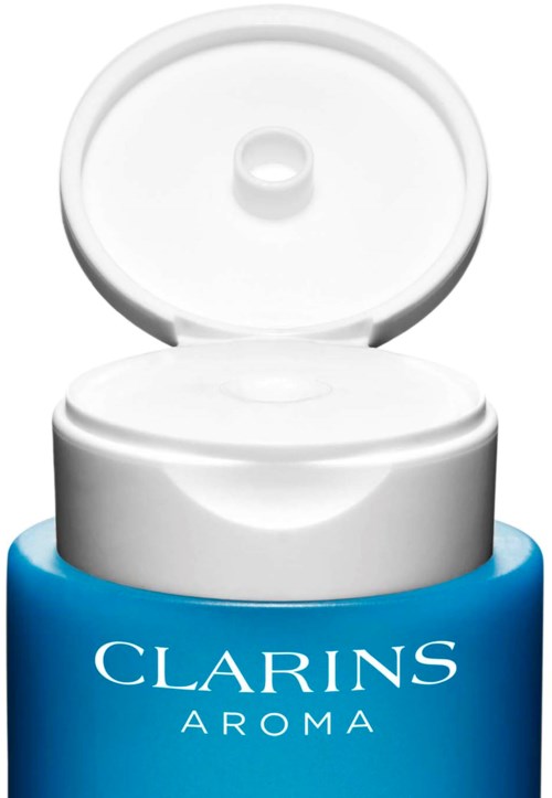 Sininen Clarins Aroma -pullo, jossa on avattu valkoinen kansi.