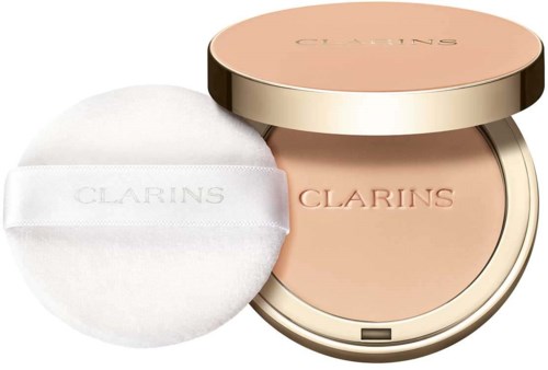 A compact with powder and a puff, both branded Clarins, in a round container with a rose gold lid.