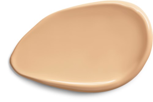 A beige liquid foundation spread on a surface, semi-oval shape with smooth texture.