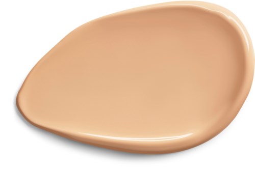 A beige liquid foundation in a flat, irregular shape spread on a black background.