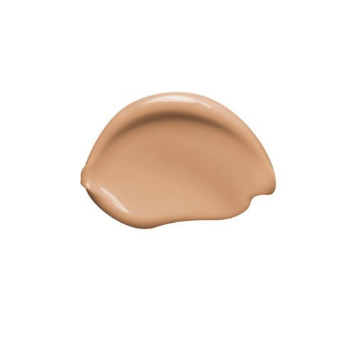 Liten mengde beige væske eller krem på hvit bakgrunn.