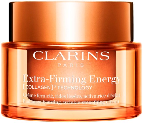 En burk med Clarins Extra-Firming Energy-kräm med kopparfärgad lock och orange behållare.