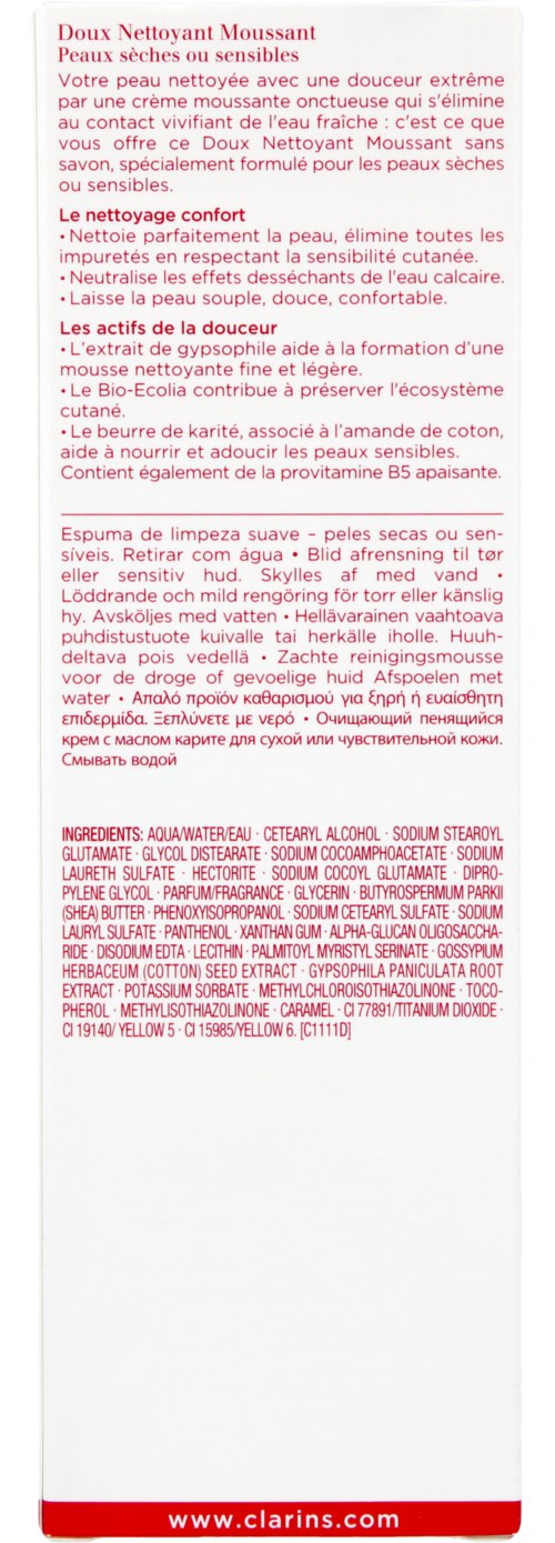 En vit flaska med röd och svart text på etiketten, innehållande produktinformation och ingredienser på flera språk.
