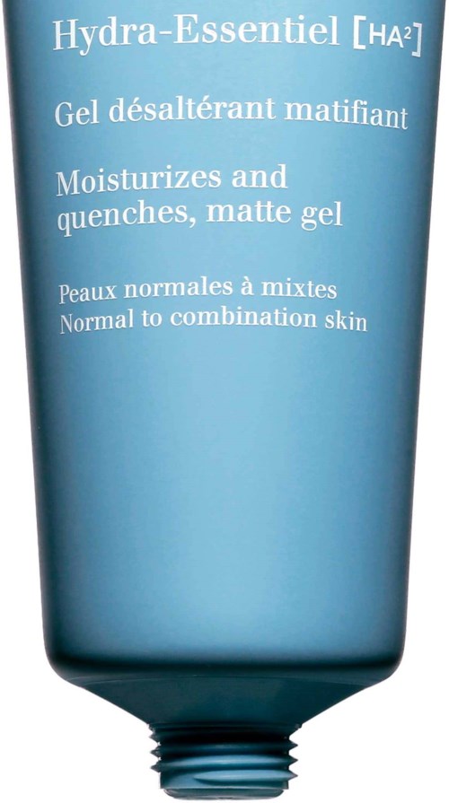 A blue tube with white text describing a skincare product for normal to combination skin.