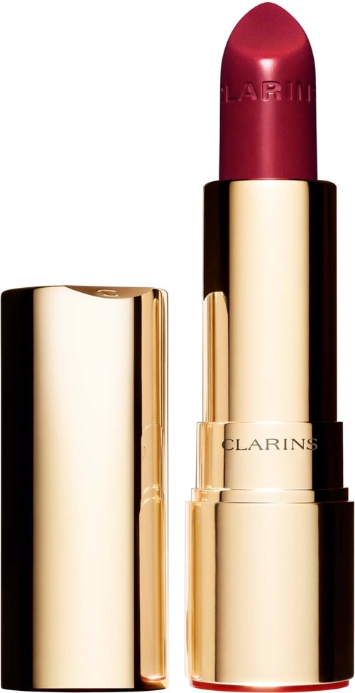 Ett guldigt läppstiftsfodral med ett rött läppstift inuti. Läppstiftet har märket 'CLARINS.'