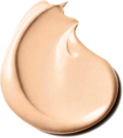 Cream-colored makeup product with a smooth, creamy texture and a slight indentation on top.