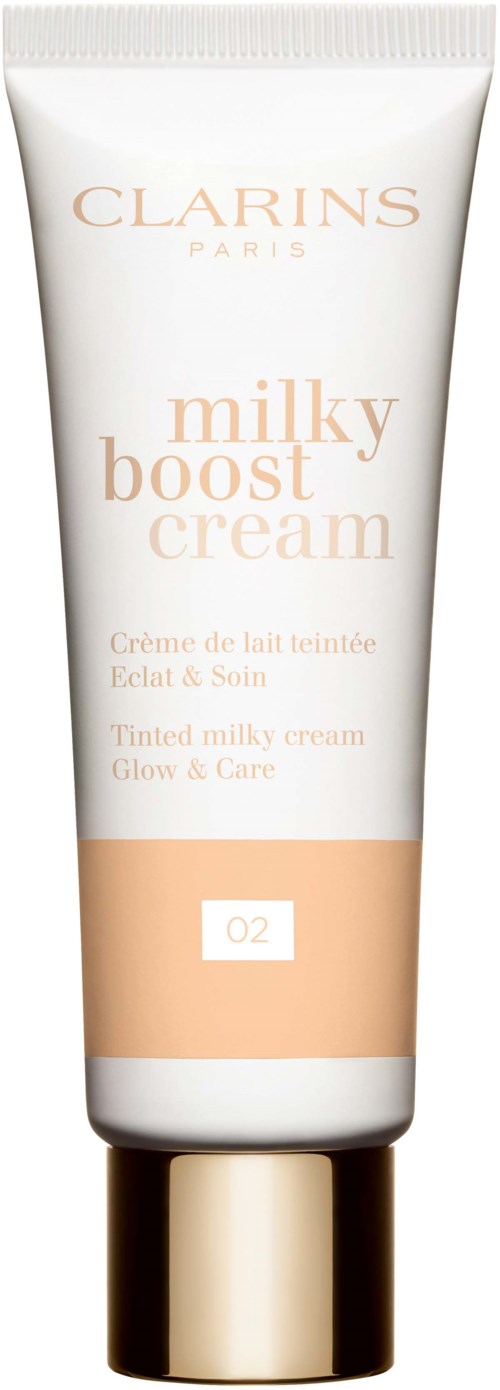 A white tube with gold cap containing Clarins milky boost cream, designed for skin care and hydration.