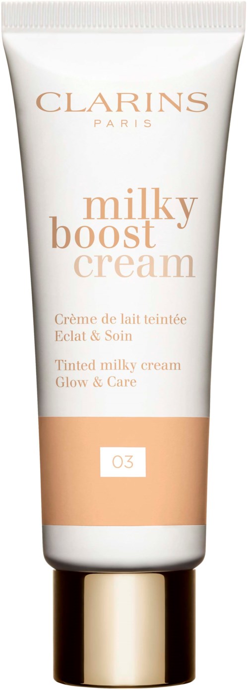 A white tube labeled Clarins Milky Boost Cream with gold cap, containing tinted milk lotion for skin care.