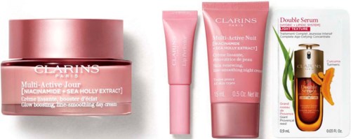Setti Clarins-huolatuotteita vaaleanpunaisissa purkeissa, sisältäen voiteen, seerumin ja näytteen.