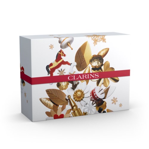 En festlig box med tomte, gyllene dekorationer och snöflingor, med märket Clarins på ett rött band.