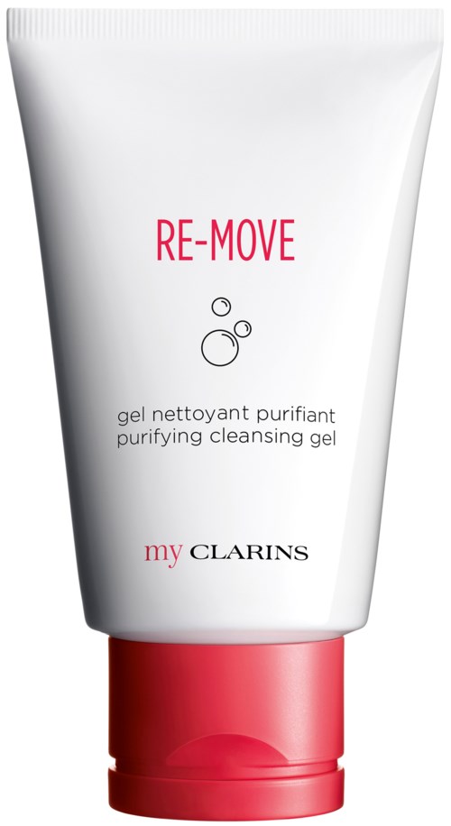 En vit tub med rosa lock, märkt 'RE-MOVE', används för renande rengöring. Märke är Clarins.