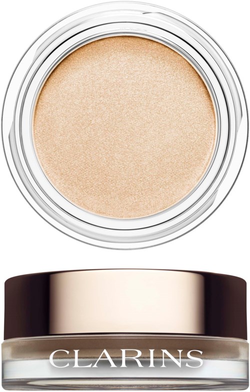 En burk med Clarins makeup- eller hudvårdsprodukt med en beige färgad kräm inuti.