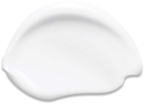 A white cream or lotion spread on a surface with a smooth, slightly curved shape.
