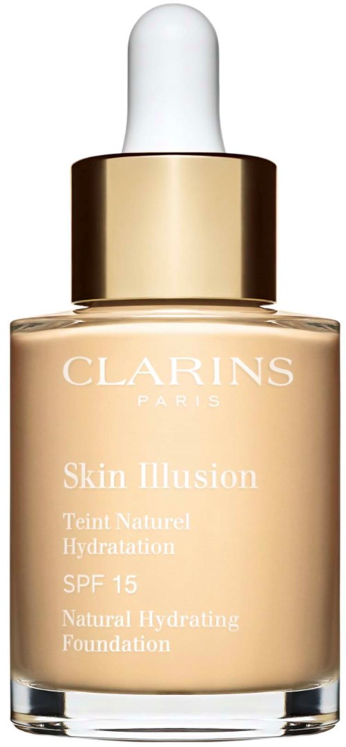 En foundationflaska med vit droppkapsel, guldkant och ljusbeige vätska inuti. Clarins-logotyp och produktdetaljer på framsidan.