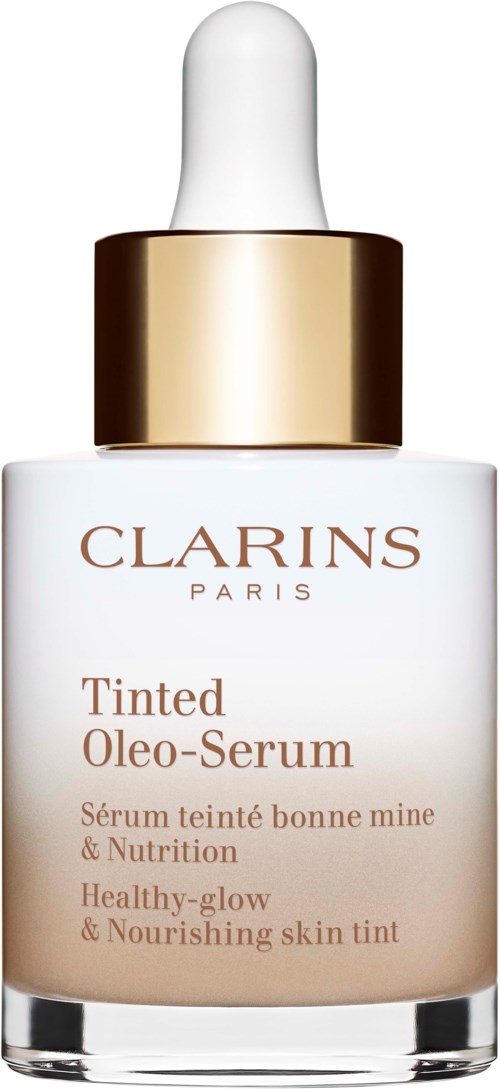 En vit flaska med guldlock innehållande Clarins Tinted Oleo-Serum, en hudvårdsprodukt för näring och lyster.
