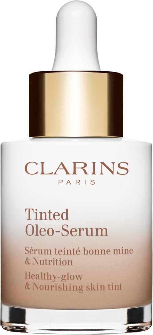 Butelka Clarins Tinted Oleo-Serum z białą kroplomierzem i złotą ozdobą, dla nawilżenia i blasku skóry.