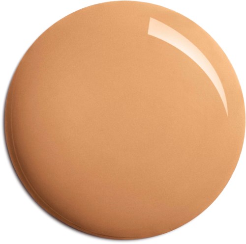En slät, rund, beige knapp med glänsande yta.
