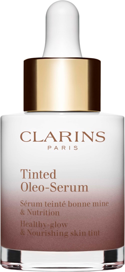 Gold and white serum bottle with a dropper, labeled 'CLARINS Paris Tinted Oleo-Serum,' for skin nourishment.