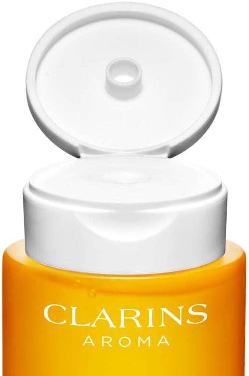 A yellow bottle with a white flip cap marked 'Clarins Aroma'.