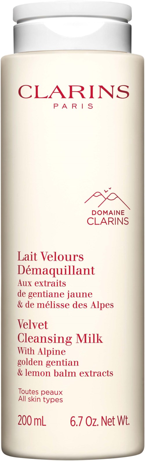 En vit flaska med röd och rosa text. Den är Clarins Velvet Cleansing Milk för alla hudtyper, med gul gentian och citronbald.