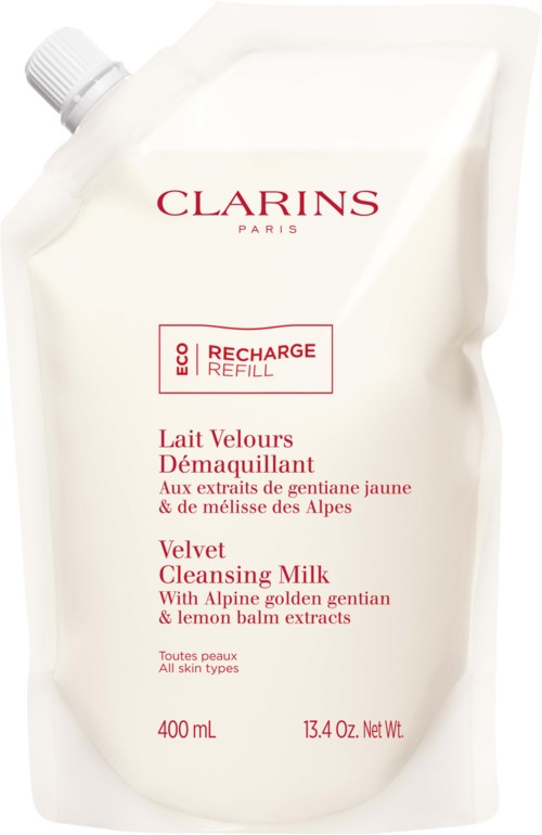 En stor vit refill-påse för Clarins Velvet Cleansing Milk, med röd och rosa text och ett litet skruvkork.