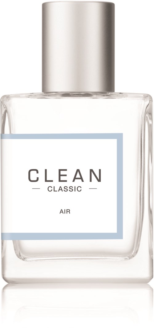 En klar glasflaske med en sølvhætte, mærket "CLEAN CLASSIC AIR". Det ligner en parfume eller luftfrisker.
