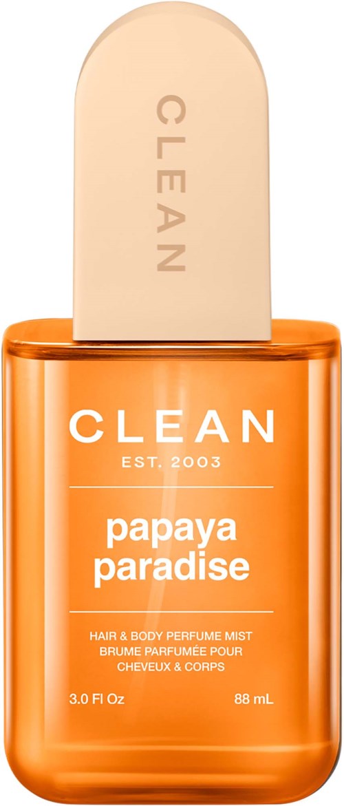 Jasnopomarańczowy pojemnik z beżową dyszą, oznaczony Clean Papaya Paradise mgiełka do włosów i ciała.
