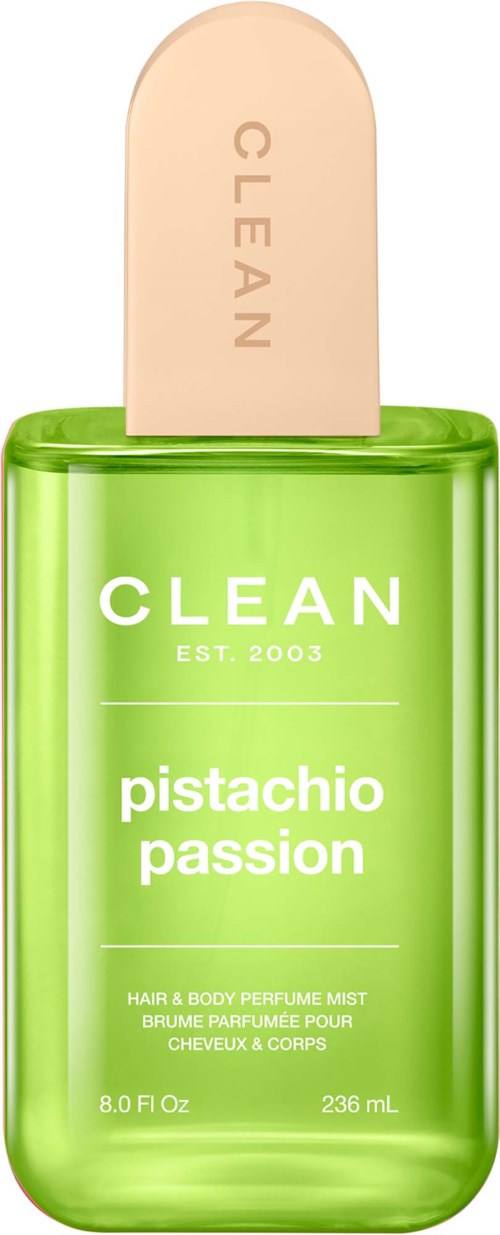 Zielony spray z etykietą Clean Pistachio Passion, beżowa nakrętka, zawiera perfumy do włosów i ciała.