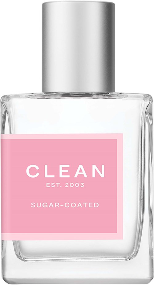 En klar glasflaska med silverlock, rosa etikett med texten 'CLEAN EST.2003 SUGAR-COATED'.