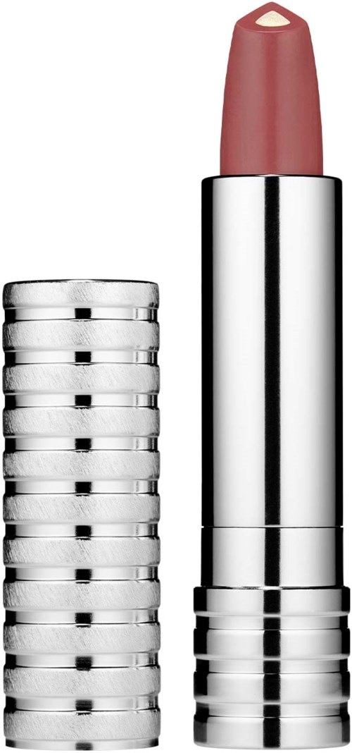 En läppstiftstift med läppstift delvis utdraget, och en stapel av silvermynt bredvid.