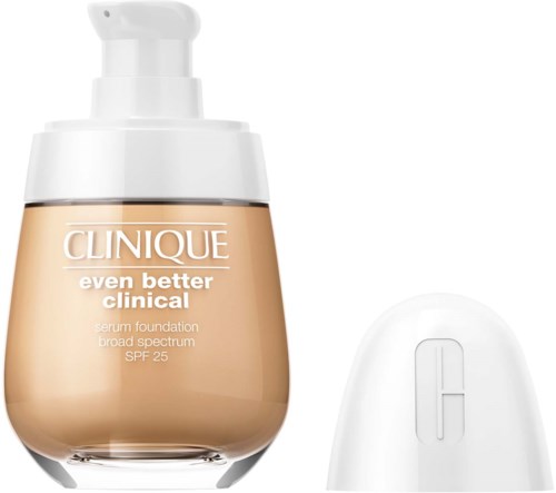 A bottle of Clinique foundation with a pump, and a white container or device next to it.