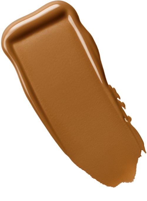 Ett streck av brun makeup eller foundation på en vit bakgrund.